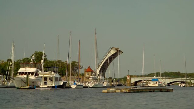Harbor with moving ships and boats and a bascule bridge