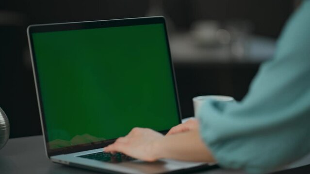 Unknown director texting chromakey laptop at coworking. Arms pressing buttons