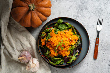 tasty roasted pumpkin salad with garlik , mix salad dress and a olive oil dressing