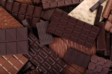 large chocolate bar, sweet candies. dessert food background.
