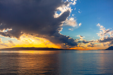Twilight and clouds over the sea . Sunlight reflection at sea water 