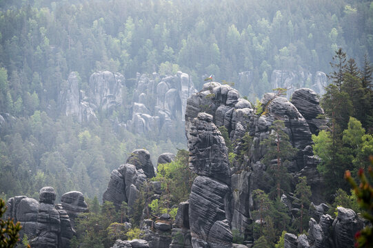 Rock city in the Adrspach Rocks with czech national flag at the top. Adrspach-Teplice Landscape Park in the Broumov Highlands region in the Czech Republic