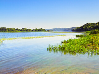 River on a sunny, cloudless, windless summer day