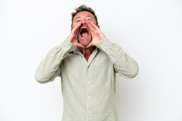 Middle age caucasian man isolated on white background shouting and announcing something