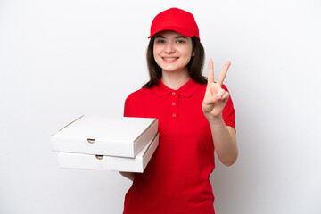 Young Russian pizza delivery picking up pizza boxes isolated on white background smiling and...