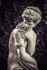 Sculpture of a beautiful woman in antique style. Monochrome