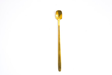 Stylish clean gold spoon on white background, top view Golden spoon on a white background Flat lay...