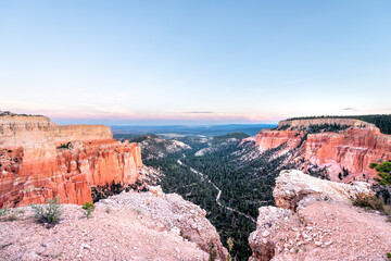 Fototapeta na wymiar High angle paria point view overlook on orange colorful hoodoos red rock formations in Bryce Canyon National Park at colorful sunset with rocks