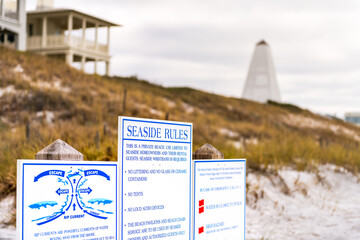Seaside, Florida panhandle with beach rules sign poster for danger rip currents, no trash and...