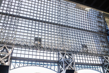 Futuristic train station steel frame wall with glass by entrance in public transportation terminal in Japan