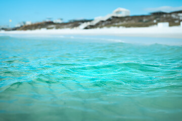 Relaxing view from inside water on coast shore beach with turquoise blue water waves at Gulf of...