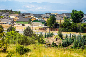 Park City, Utah residential community neighborhood villa by canyons in summer with property construction houses work, Wasatch mountain in background
