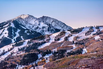  Aerial high angle view of ski resort town city of Aspen, Colorado after winter snow on Buttermilk mountain slopes with valley in autumn fall © Andriy Blokhin