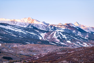 Aspen, Colorado Elk Snowmass range of Rocky mountains in snow in autumn or winter by Buttermilk ski resort slope mountain at morning sunrise