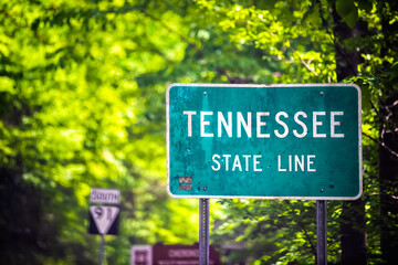 Welcome to Tennessee road highway sign with state border line of Virginia by Great smoky mountains...