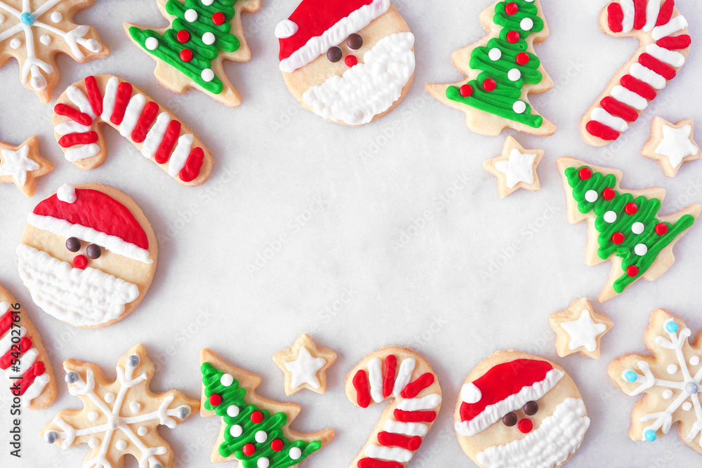 Poster cute christmas cookie frame. top down view on a white marble background with copy space. holiday bak