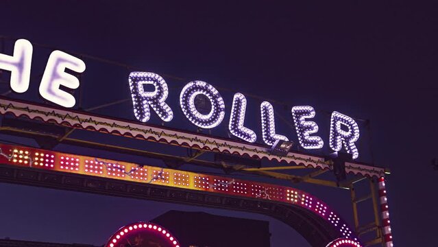 Funfair lights detail at night. Evocative image of amusement park