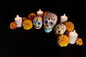 Dia de los muertos - Day of the dead Sugar skull with candles, and cempasuchil flowers altar...