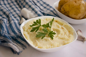 Mashed potatoes on old wooden background