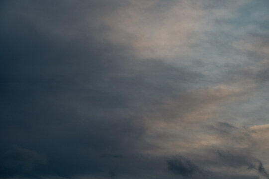 Dark blue stormy sky with clouds, abstract nature background