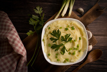 Mashed potatoes on old wooden background