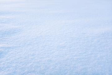 Obraz premium Light blue snow background. Fluffy snow texture for a poster, calendar, post, screensaver, wallpaper, postcard, banner, cover, website. High quality photo