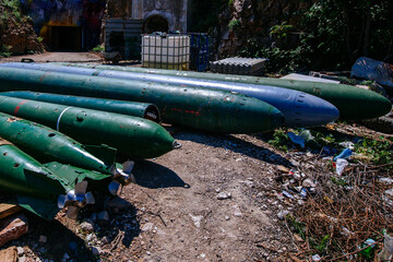 Green submarine torpedoes with propellers, close up view