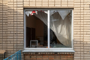 War in Ukraine. 2022 Russian invasion of Ukraine. Window damaged after shelling (close-up)....
