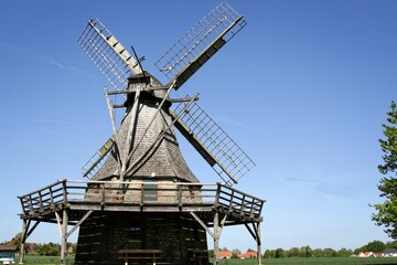 Old historic wooden windmill in the countryside