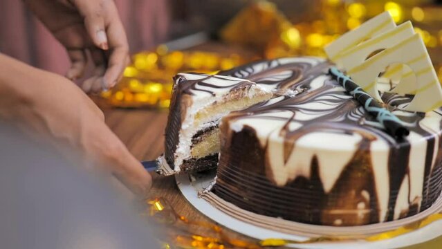 Birthday Cake Cutting, chocolate cake on a plate