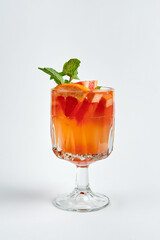Orange cocktail with grapefruit and mint in a crystal glass