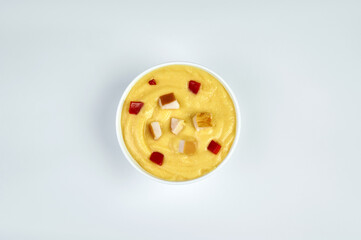 Sliced mashed potatoes in a white plate, white background