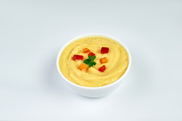 Sliced mashed potatoes in a white plate, white background