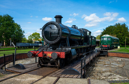 Black Steam Train on rail turn table
