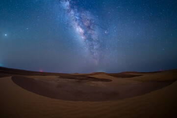 Milky way in desert above sand dune, empty quarter, Abu Dhabi, UAE.
