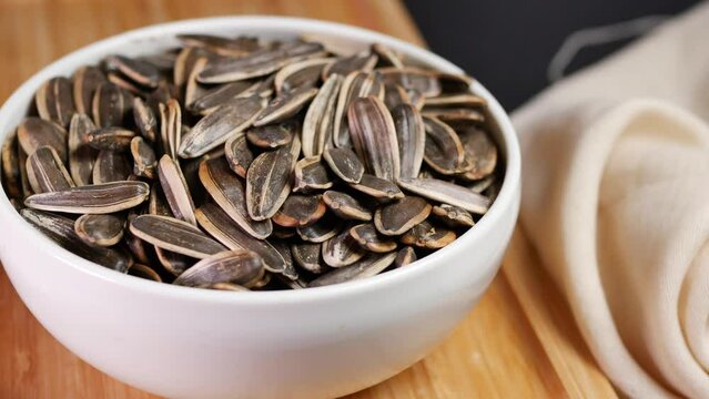 sunflower seeds in a bowl on table 