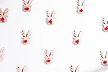 Fotobehang Christmas composition with deer pattern. Top view © YuliiaMazurkevych
