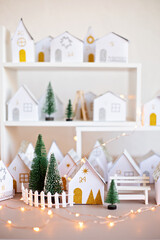 Handmade advent calendar. Houses shaped gift boxes. Eco friendly Christmas gifts diy concept