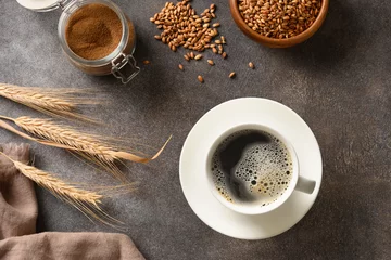  Cooking healthy barley coffee on brown background. Best natural caffeine free organic coffee alternative. Coffee substitute beverage made of a blend of roasted barley. View from above. © svetlana_cherruty