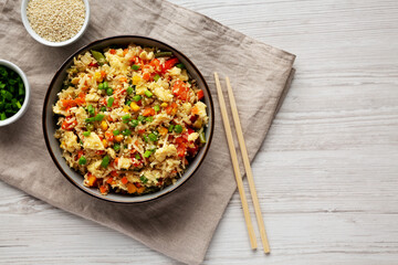 Homemade Cauliflower Fried Rice with Chives and Sesame Seeds in a Bowl, top view. Flat lay,...