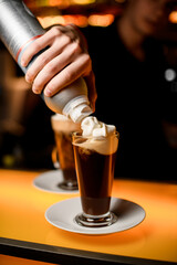 selective focus male hand which decorate by whipped cream latte glass with coffee.