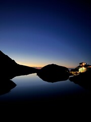 Mountain lake against sunset