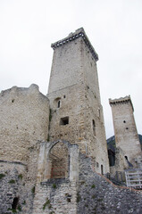 Fototapeta na wymiar Pacentro, Abruzzo - Italy - The imposing towers of the Caldora or Cantelmo Castle overlook the characteristic mountain village 