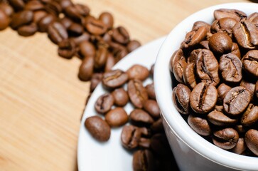 Closeup shot of a bunch of coffee beans in a cup