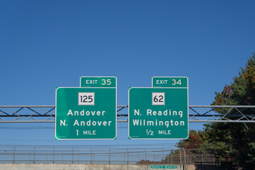 Highway signs on Route 93 Northbound in Wilmington, Massachusetts: Exit 34, Route 62 toward N....