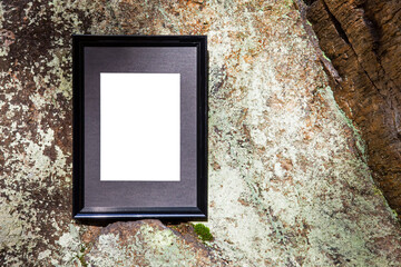 Picture frame on rock background. Empty frame with copy space passe partout, natural background, art information, sign concept