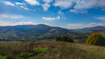 Fototapeta na wymiar Autumn landscape backgroun in the sunny weather with clouds