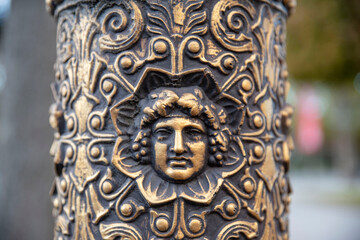 Detail of a street lamp post sculpture in the streets of Paris, France
