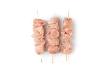 Raw uncooked Chicken meat, kebab on skewers isolated on a white background with clipping path, cut out.