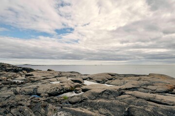 Aerial view of rock formations on the shore overlooking the sea